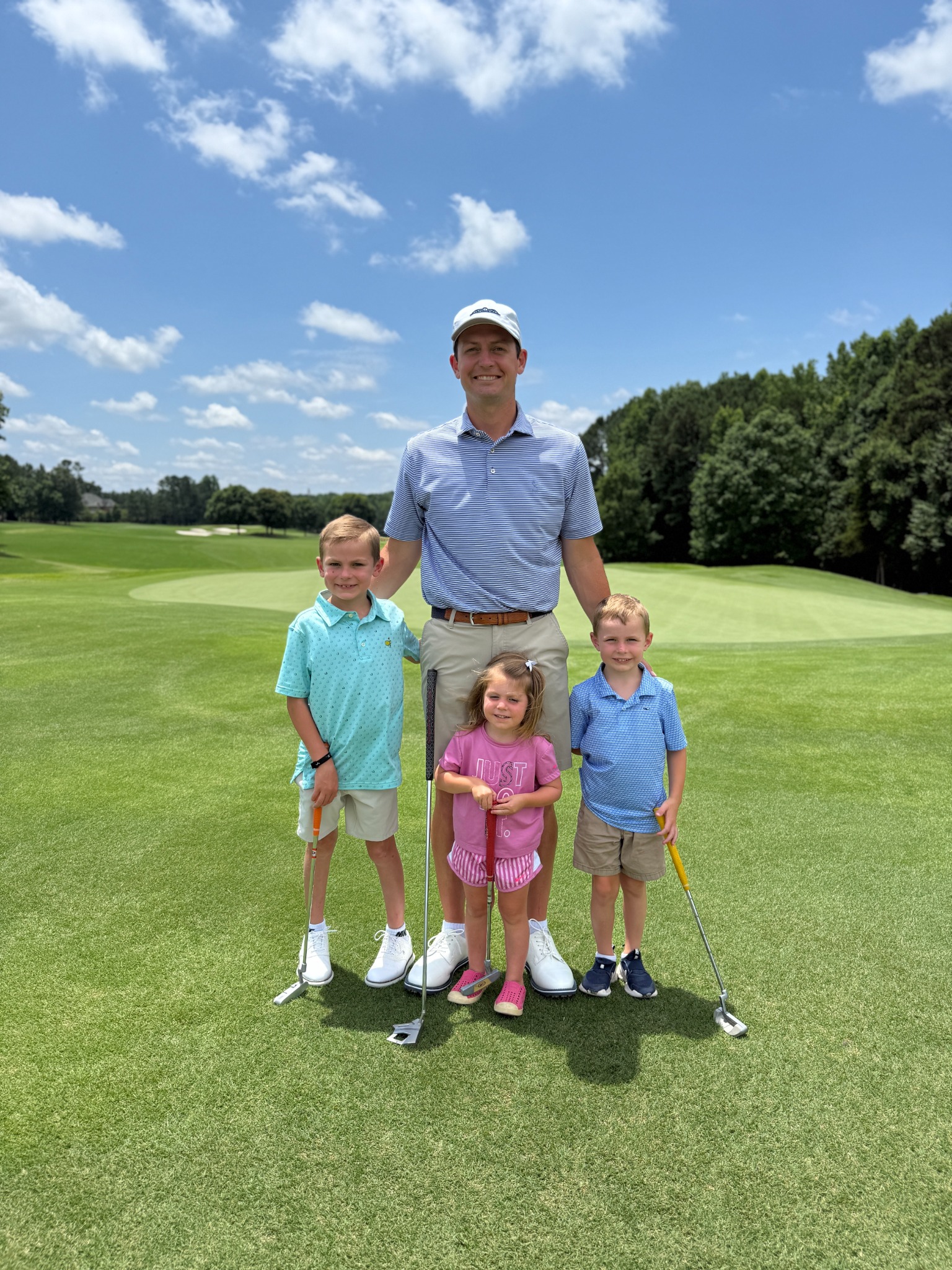 Father and junior golfer at a tournament